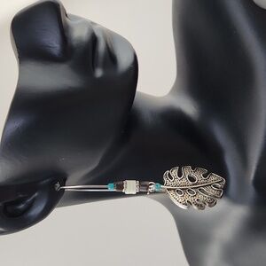 Boho style earrings with leaf pendant